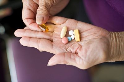 Pills in older woman's hands 5-20-11-2