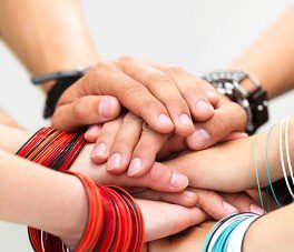 Hands of young guys and girls