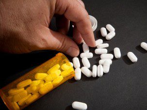 Taking Narcotic Pills, a leading prescription drug that is abused.