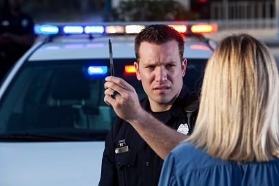 Police officer conducting sobriety test