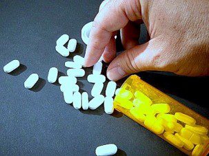 hand with pills 10-8-13