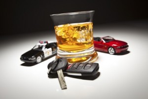 Highway Patrol Police and Sports Car Next to Alcoholic Drink and Keys Under Spot Light.